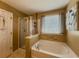 Modern bathroom with a separate shower and a soaking tub, perfect for relaxation at 2775 Storybook Ct, Grayson, GA 30017
