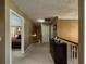 Well-lit upstairs hallway with access to bedrooms and plenty of natural light at 2775 Storybook Ct, Grayson, GA 30017