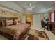 Well-appointed main bedroom featuring a tray ceiling, large bed, and neutral tones at 2775 Storybook Ct, Grayson, GA 30017