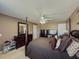 Cozy main bedroom featuring neutral walls, four-poster bed, and matching dark wood furniture at 2775 Storybook Ct, Grayson, GA 30017