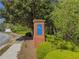 Hawthorne Green Community signage, highlighting the neighborhood's entrance with lush landscaping at 2775 Storybook Ct, Grayson, GA 30017