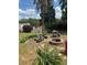 Landscaped backyard with lush greenery and a stone fire pit area at 280 Ridge Bluff Ln, Suwanee, GA 30024