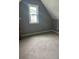 Cozy bedroom with neutral carpet and a window for natural light at 280 Ridge Bluff Ln, Suwanee, GA 30024
