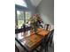 Dining room with large windows and elegant floral arrangement as a centerpiece at 280 Ridge Bluff Ln, Suwanee, GA 30024