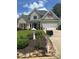 Charming gray two-story home with manicured landscaping and stone accents at 280 Ridge Bluff Ln, Suwanee, GA 30024