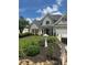 Charming gray two-story home with manicured landscaping and stone accents at 280 Ridge Bluff Ln, Suwanee, GA 30024