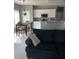 Open concept living room and kitchen with a dining table near a window at 280 Ridge Bluff Ln, Suwanee, GA 30024
