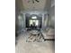 Spacious living room with high ceilings, decorative columns, and a view into the dining room at 280 Ridge Bluff Ln, Suwanee, GA 30024