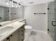 Bathroom featuring a sink, vanity, shower and toilet with black hardware and a large mirror at 4254 River Green Nw Dr # 612, Atlanta, GA 30327