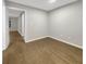 Bedroom features hardwood floors, and a view into the hall from the door at 4254 River Green Nw Dr # 612, Atlanta, GA 30327
