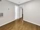 Bedroom features hardwood floors, neutral paint, and multiple doors at 4254 River Green Nw Dr # 612, Atlanta, GA 30327