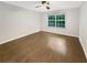 The bedroom features hardwood floors, natural light from the window, and neutral walls at 4254 River Green Nw Dr # 612, Atlanta, GA 30327