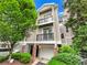 Charming townhome with a two-car garage and a lovely front exterior with brick columns and private balconies at 4254 River Green Nw Dr # 612, Atlanta, GA 30327