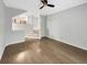 Open living room space with beautiful hardwood flooring, a ceiling fan, and natural light at 4254 River Green Nw Dr # 612, Atlanta, GA 30327