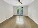 Spacious bedroom with hardwood flooring, a ceiling fan, and natural light from the large windows at 4254 River Green Nw Dr # 612, Atlanta, GA 30327