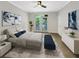 Sun-lit main bedroom with ensuite bath, large windows, and ceiling fan at 4254 River Green Nw Dr # 612, Atlanta, GA 30327