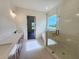 Elegant bathroom featuring a double vanity, glass shower, and standalone tub at 6490 Mockingbird Rd, Cumming, GA 30028