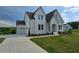 Lovely two-story home with attached garage and manicured green lawn at 6490 Mockingbird Rd, Cumming, GA 30028