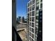 Scenic balcony view overlooking highway traffic with black iron railing and city buildings at 1280 W Peachtree Nw St # 2801, Atlanta, GA 30309