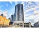 Striking exterior of a high-rise building with multiple balconies under a beautiful sky at 1280 W Peachtree Nw St # 2801, Atlanta, GA 30309