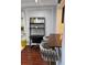 Cozy dining area with stylish bar stools, a dark wood counter, a modern desk, and trendy wall decor at 1280 W Peachtree Nw St # 2801, Atlanta, GA 30309
