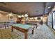 Relaxing game room featuring pool tables, soft lighting, and a stylish carpet at 1280 W Peachtree Nw St # 2801, Atlanta, GA 30309