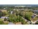Beautiful aerial view showcases community near wooded area and the Outlet Shoppes at Atlanta at 130 Inwood Walk, Woodstock, GA 30188