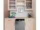 Close-up of bar area with cabinetry, shelving, a mini-refrigerator, and counter space at 130 Inwood Walk, Woodstock, GA 30188