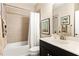 Clean bathroom with tile surround, soaking tub, and modern fixtures at 130 Inwood Walk, Woodstock, GA 30188