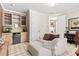 Bonus room featuring custom cabinetry, a beverage fridge and lounge area at 130 Inwood Walk, Woodstock, GA 30188