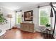 Elegant dining room with a decorative buffet, large windows and hardwood floors at 130 Inwood Walk, Woodstock, GA 30188