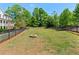 Fully fenced dog park with a fire pit and seating at 130 Inwood Walk, Woodstock, GA 30188