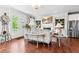 Open concept living room with a fireplace, built-in shelving and French doors at 130 Inwood Walk, Woodstock, GA 30188