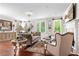 Elegant living room with hardwood floors, fireplace, comfortable seating and natural light at 130 Inwood Walk, Woodstock, GA 30188