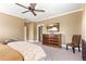 Bedroom with neutral walls and carpet with a wooden dresser and flat screen television at 130 Inwood Walk, Woodstock, GA 30188
