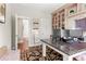 Bright office with a built-in bookshelf and desk, offering a functional workspace and stylish design at 130 Inwood Walk, Woodstock, GA 30188