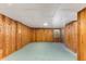 Unfinished basement with wood paneled walls offers potential for a variety of uses at 2357 Burnt Creek Rd, Decatur, GA 30033