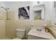 Bathroom with a single sink vanity, a mirror, and neutral-colored tile at 2357 Burnt Creek Rd, Decatur, GA 30033