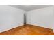 Bedroom with hardwood floors, white walls, and an interior door at 2357 Burnt Creek Rd, Decatur, GA 30033
