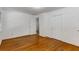 Bedroom featuring hardwood floors and a closet with sliding doors at 2357 Burnt Creek Rd, Decatur, GA 30033