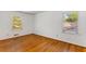 Bedroom with hardwood floors, white walls, and natural light through bright windows at 2357 Burnt Creek Rd, Decatur, GA 30033