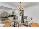 Dining area with hardwood floors, chandelier, and view into the living room at 2357 Burnt Creek Rd, Decatur, GA 30033