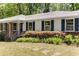 Detailed view of the home's exterior with well-maintained landscaping and classic architectural details at 2357 Burnt Creek Rd, Decatur, GA 30033