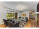Bright living room with hardwood floors, neutral decor, and a screened patio that brings the outside in at 2357 Burnt Creek Rd, Decatur, GA 30033