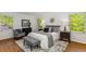 Calm main bedroom with natural light, neutral colors, and hardwood floors for a relaxing atmosphere at 2357 Burnt Creek Rd, Decatur, GA 30033