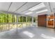 Bright sunroom features abundant windows and a view of the surrounding trees at 2357 Burnt Creek Rd, Decatur, GA 30033