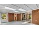 Spacious sunroom with brick walls and views into the interior and exterior at 2357 Burnt Creek Rd, Decatur, GA 30033