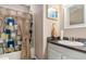 Bright bathroom features a shower-tub combination and a vanity with a granite-look countertop at 25 Bridlewood Ct, Stockbridge, GA 30281