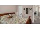 Bedroom featuring a full size bed, floral bedding and a view of the hallway at 25 Bridlewood Ct, Stockbridge, GA 30281