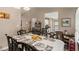 Dining room view showing table setting, cabinet, and open access to the kitchen area at 25 Bridlewood Ct, Stockbridge, GA 30281